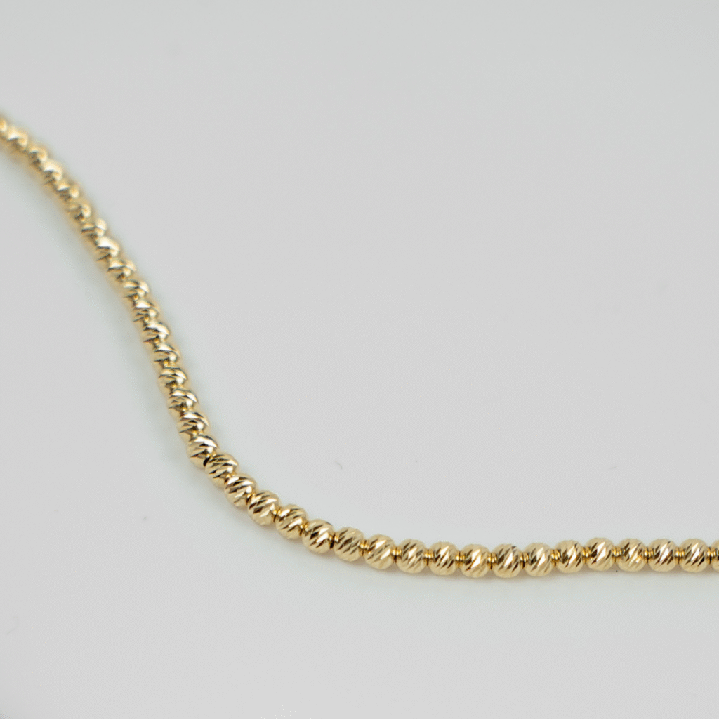 Bransoletka pozłacana z grawerowanymi kuleczkami Blink