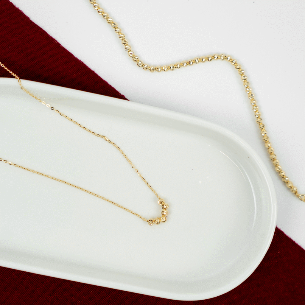 Bransoletka pozłacana z grawerowanymi kuleczkami Blink